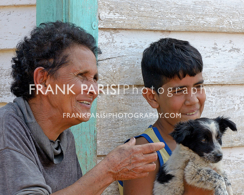 Maria and her grandson, with dog.
